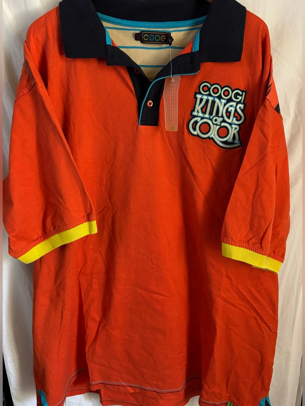 COOGI Orange Polo with Navy Collar and Yellow Trim